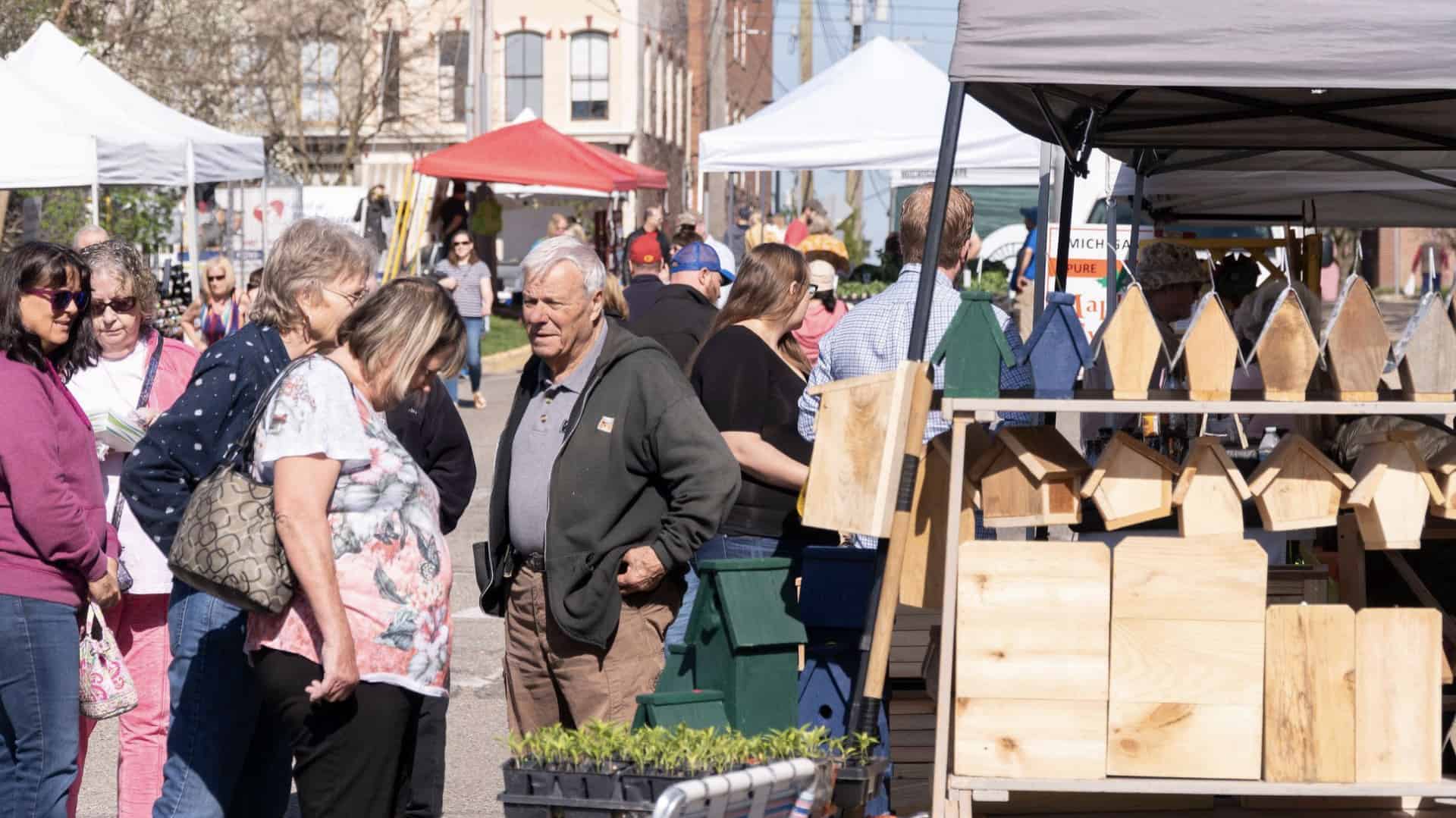 patrons walk around the Howell Farmer’s Market