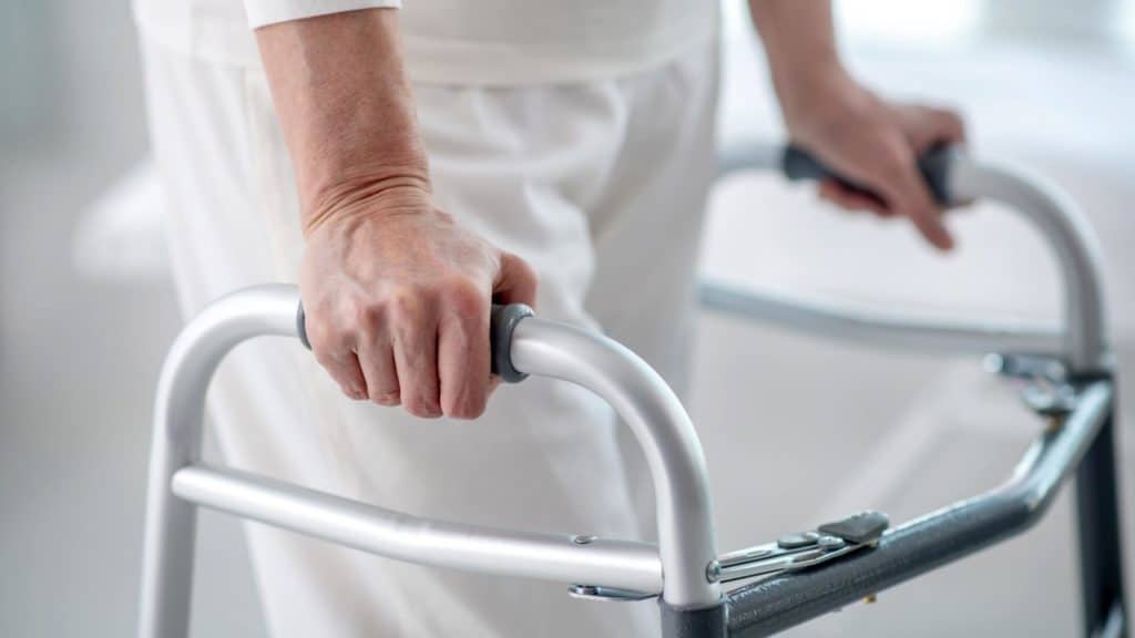 How long does it take to recover from a neurosurgical procedure? a patient walks with a walker