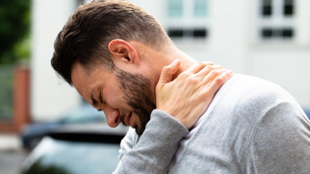 a person experiencing neck pain