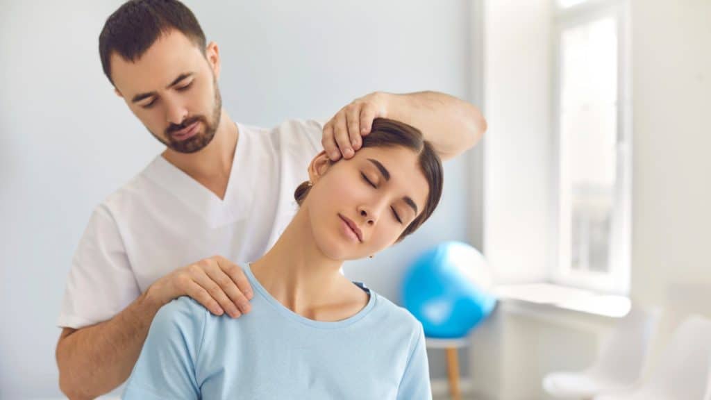 a chiropractor cracks a patient’s neck | Frequently Asked Questions | NorthEast Spine and Sports Medicine