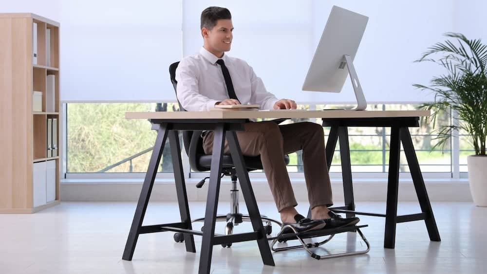 Man sitting with adjusted posture | Maintain Good Posture | Northeast Spine and Sports Medicine