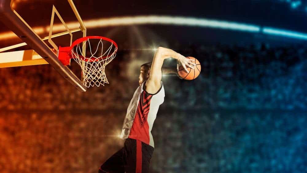 Basketball player about to dunk the ball | Northeast Spine and Sports Medicine