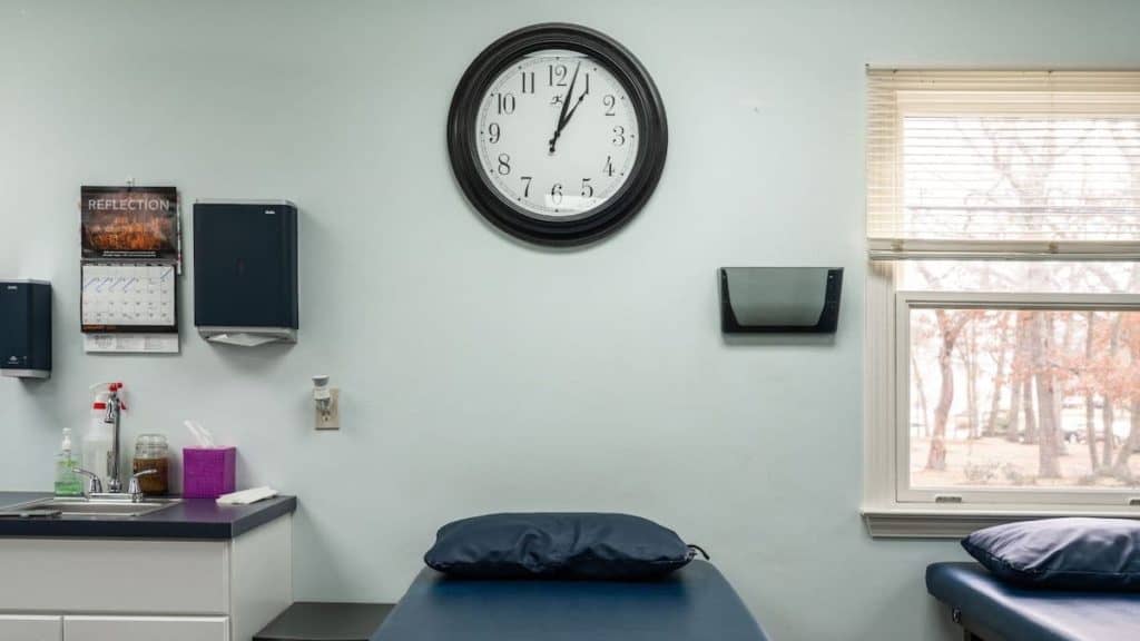 Close up of black clock on the wall of exam room at NorthEast Spine and Sports Medicine