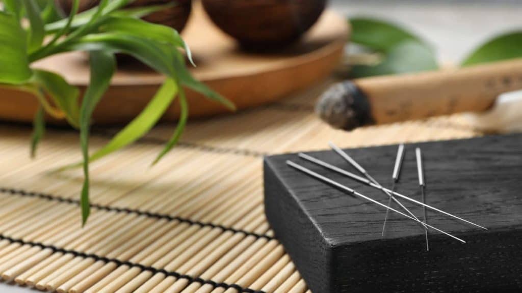 Acupuncture needles on a black box | NorthEast Spine & Sports Medicine