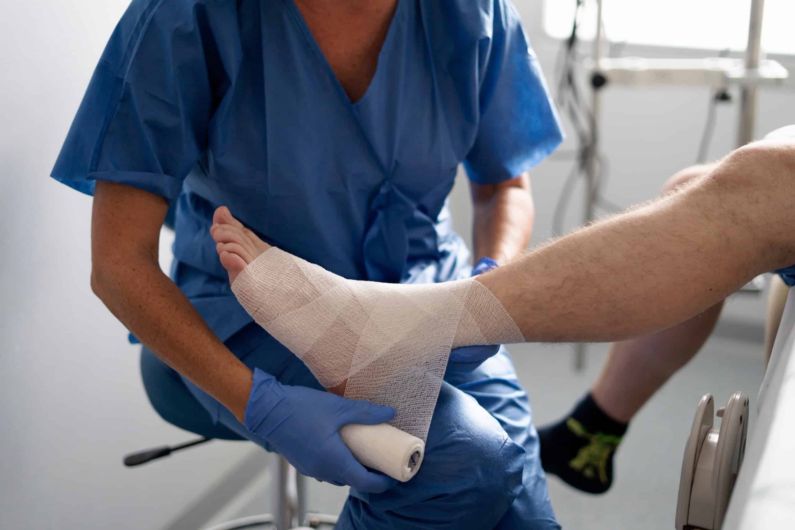 Provider applying a bandage | Ankle sprain recovery time